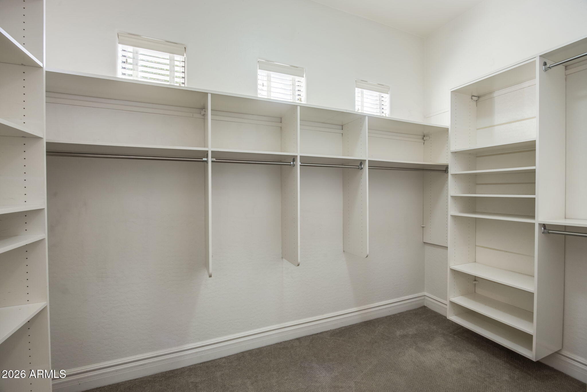 3215 East Constance Way Phoenix, AZ 85042 - Photo 26 of 40 a view of an empty walk in closet