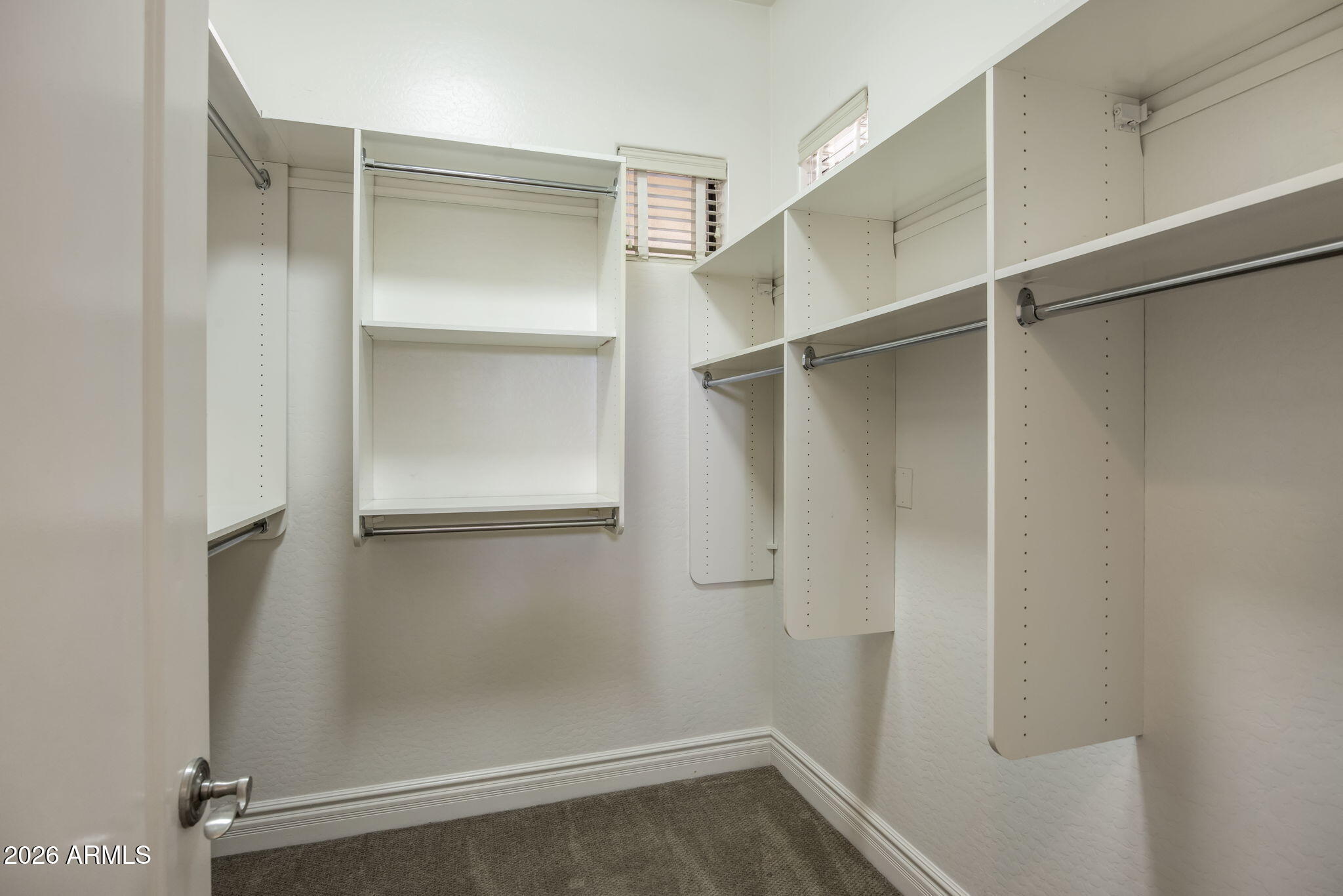 3215 East Constance Way Phoenix, AZ 85042 - Photo 27 of 40 a view of an empty walk in closet