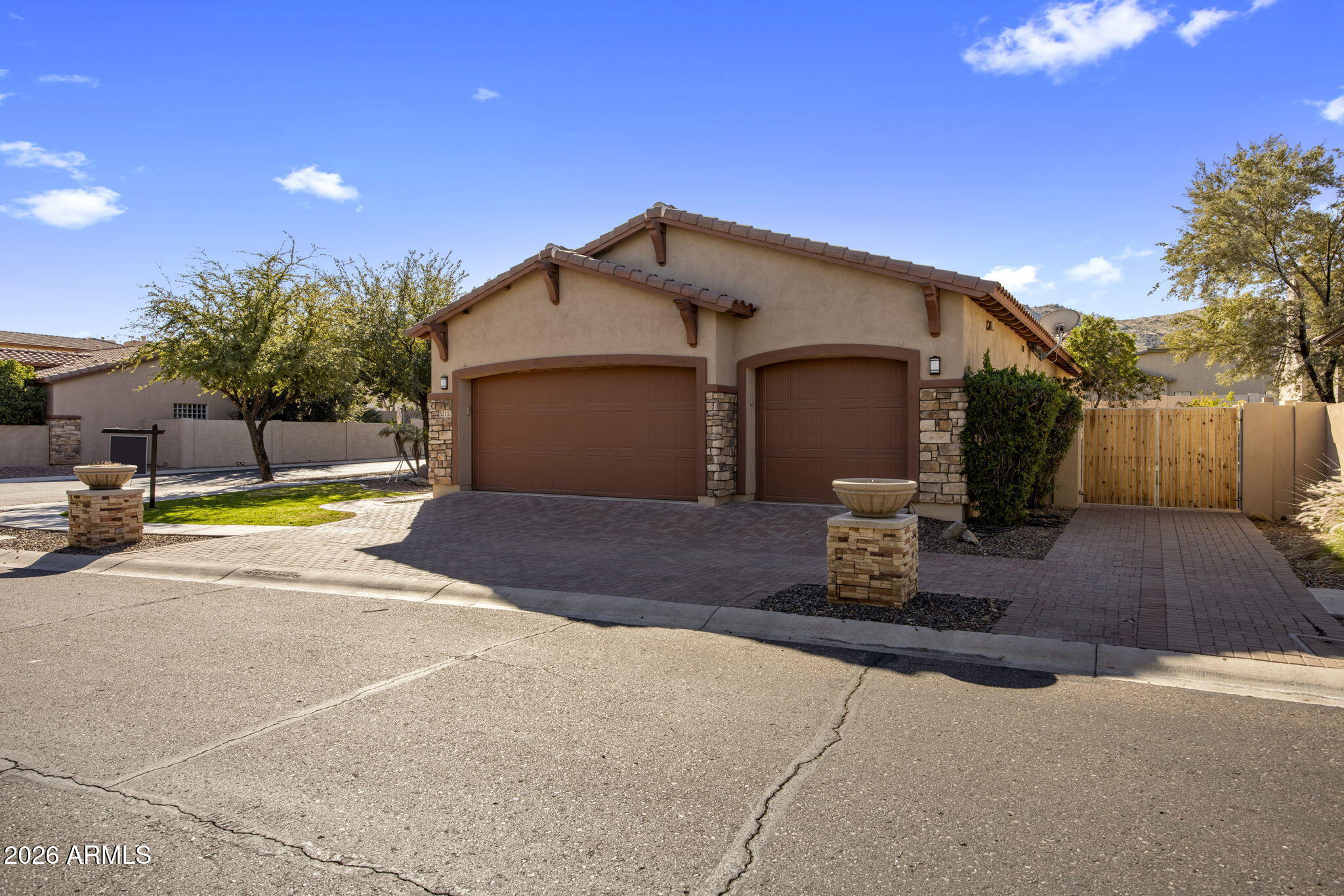 3215 East Constance Way Phoenix, AZ 85042 - Photo 31 of 40 a view of a house with entertaining space and a yard