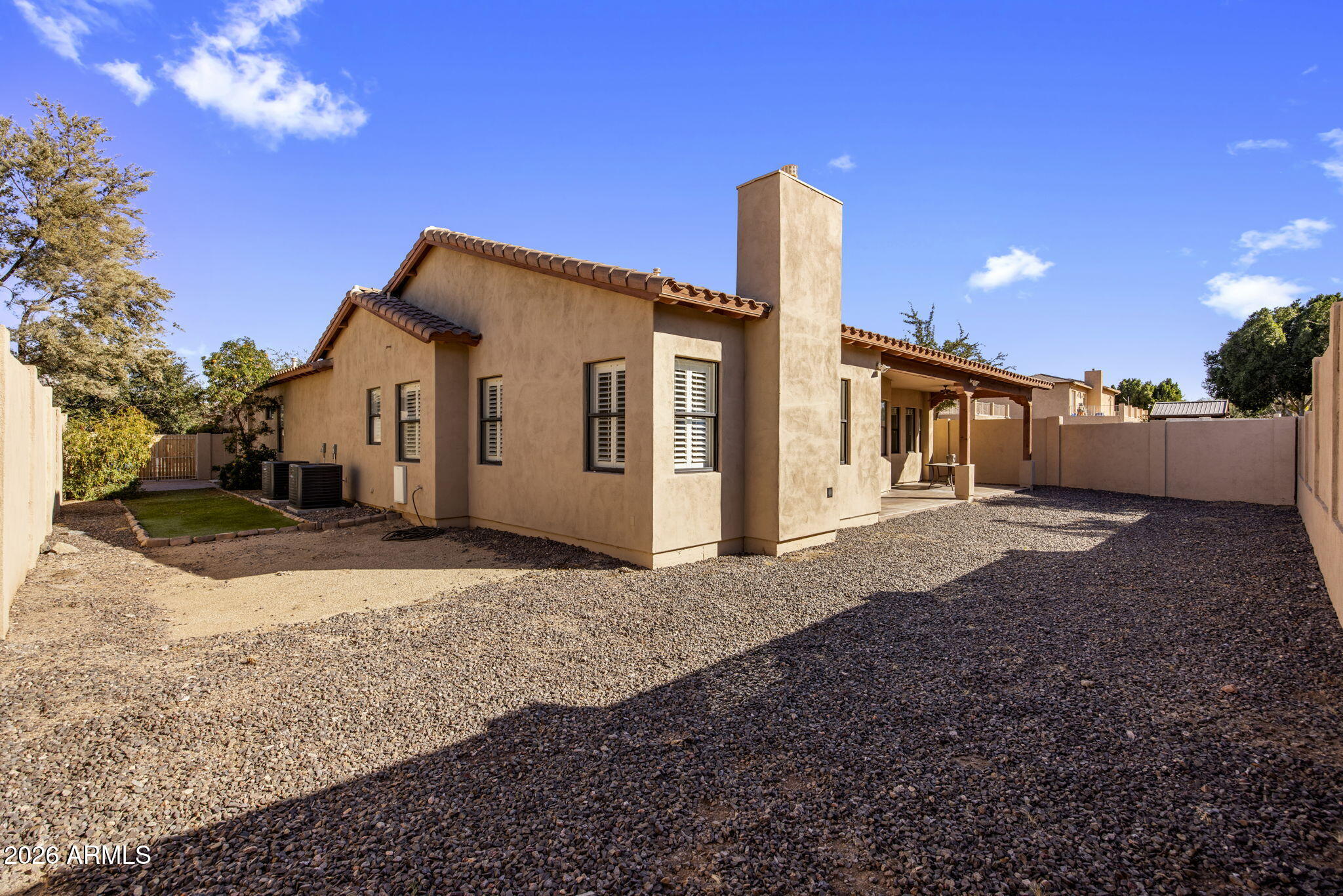 3215 East Constance Way Phoenix, AZ 85042 - Photo 32 of 40 a front view of a house with a yard and garage