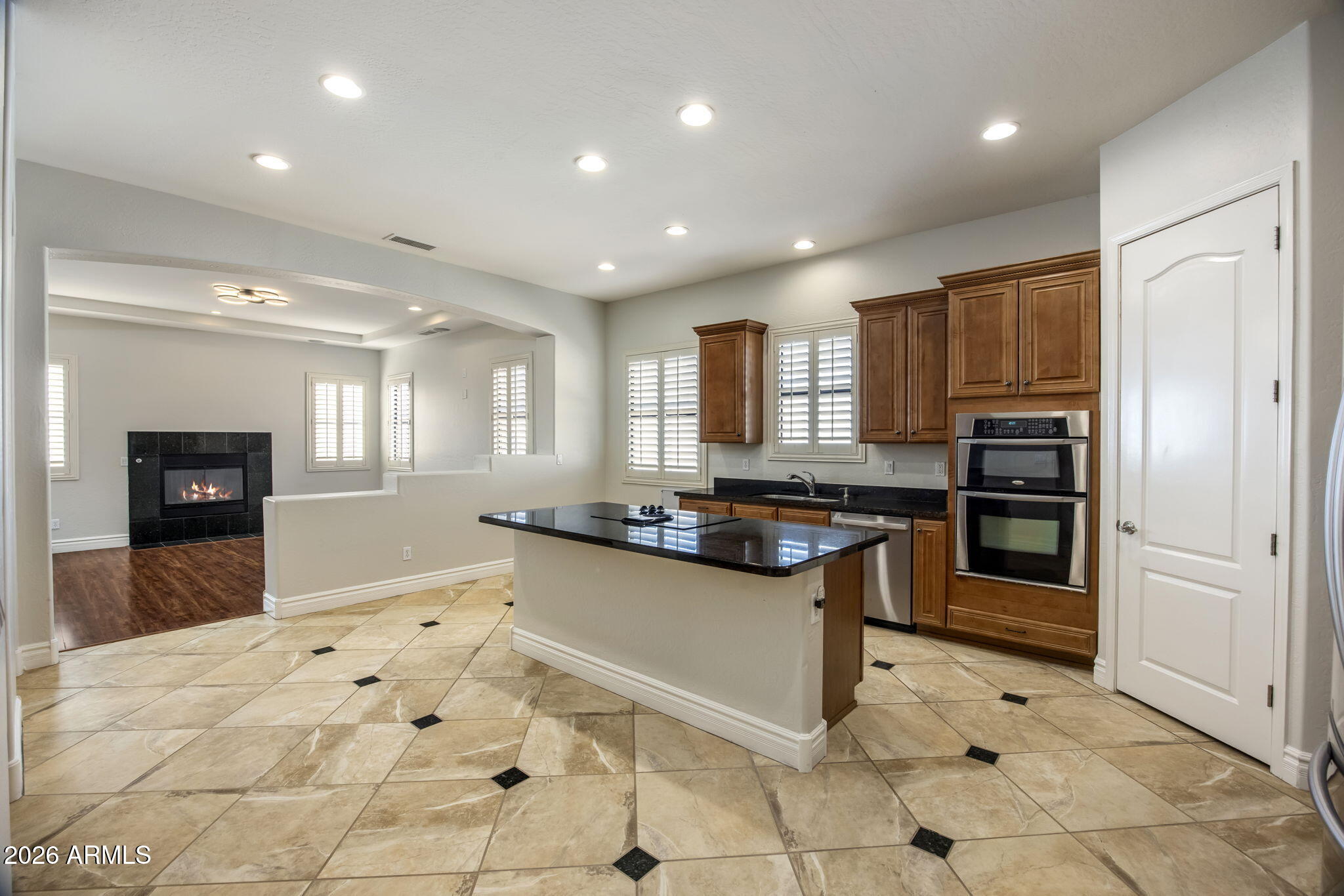 3215 East Constance Way Phoenix, AZ 85042 - Photo 7 of 40 a kitchen with stainless steel appliances granite countertop a refrigerator and a sink