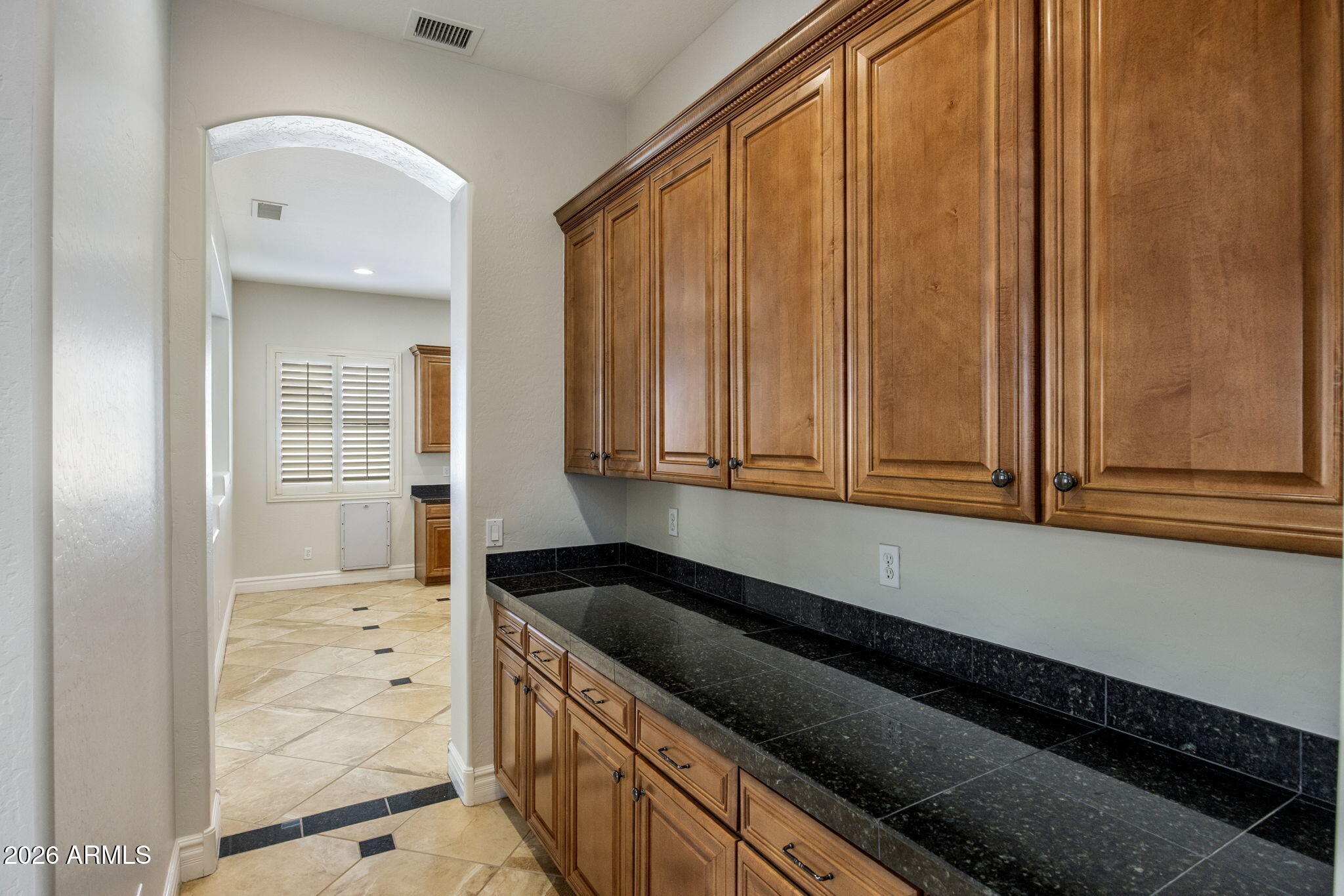 3215 East Constance Way Phoenix, AZ 85042 - Photo 8 of 40 a kitchen with granite countertop white cabinets and sink
