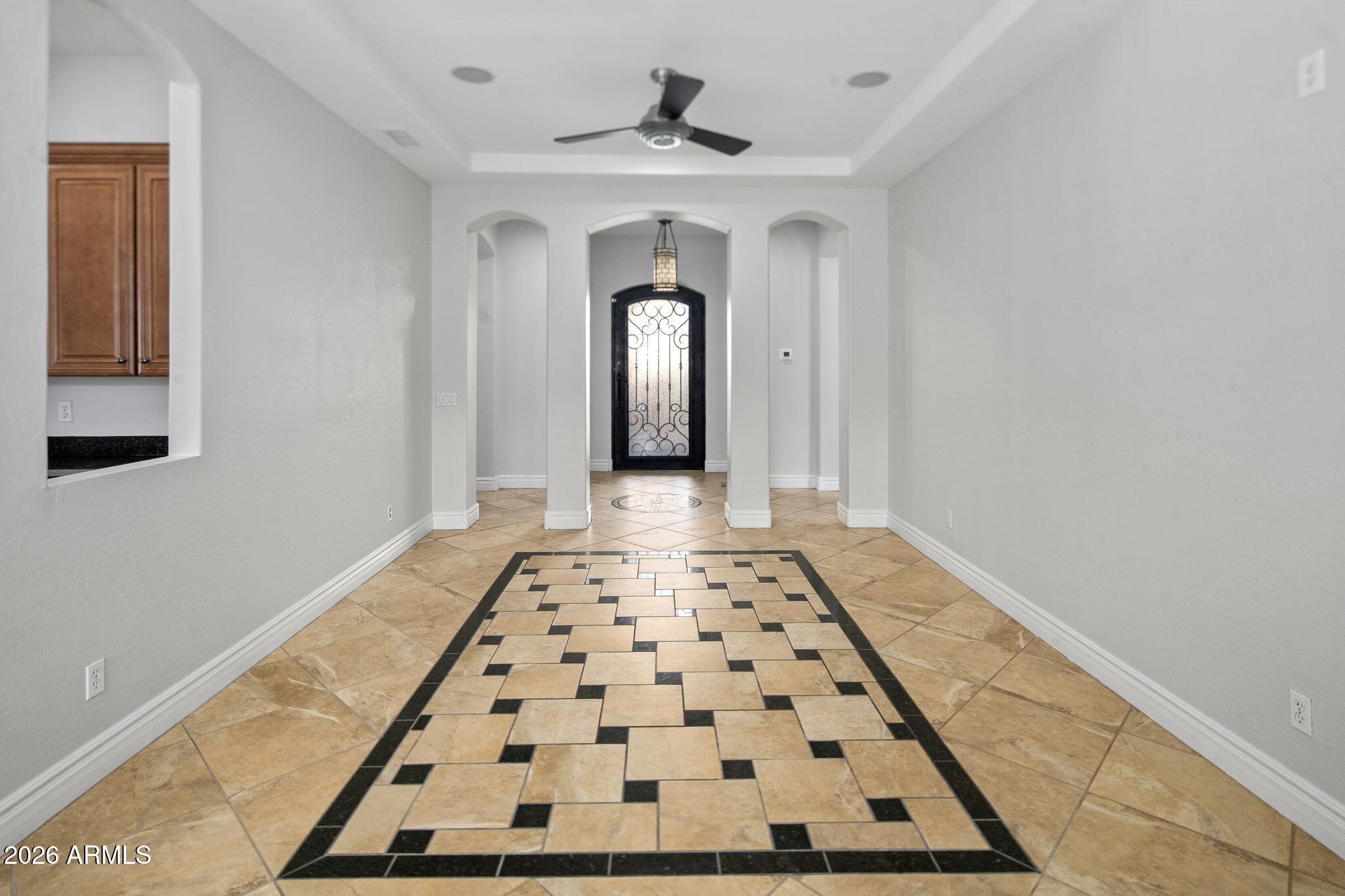 3215 East Constance Way Phoenix, AZ 85042 - Photo 9 of 40 a view of a hallway with windows and flower pot
