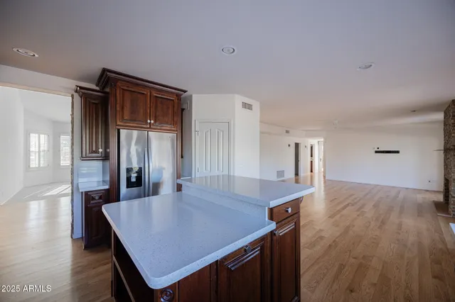 a dining hall with a dining table and chairs with wooden floor