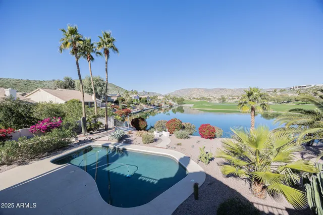 a view of a city from a balcony with outdoor space