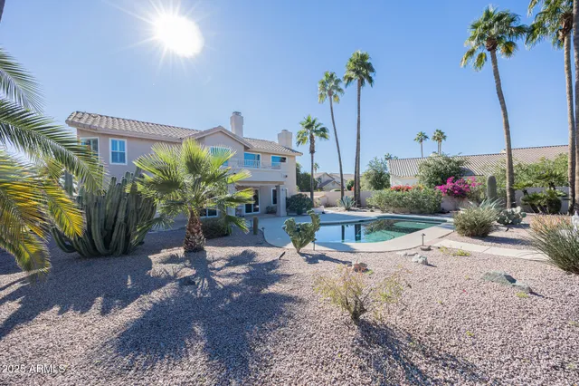 swimming pool view with a seating space