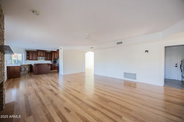 a view of a kitchen with a sink and a stove top oven