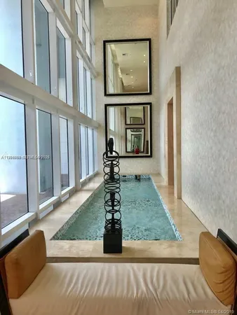 a view of living room with furniture and window