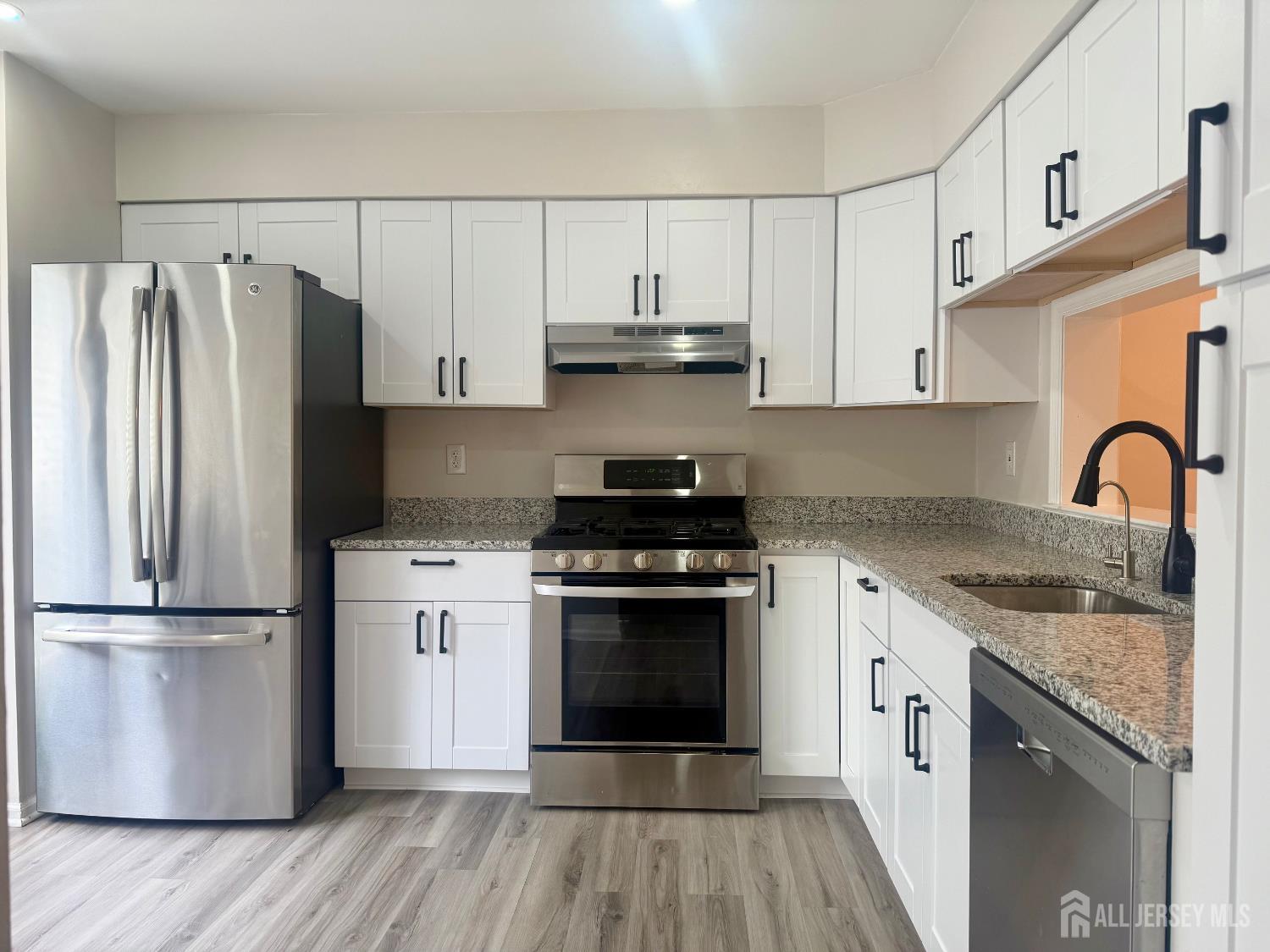 205 Timber Oaks Road Edison, NJ 08820 - Photo 3 of 4 a kitchen with a sink stove and refrigerator