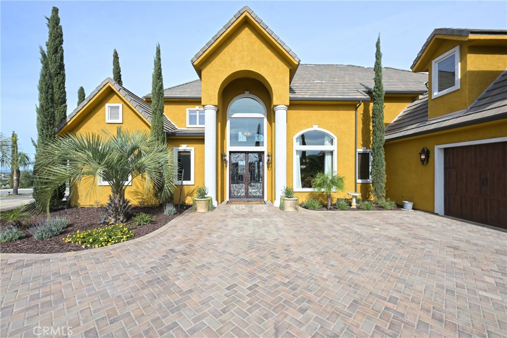 38101 Vía Lobato Temecula, CA 92592 - Photo 2 of 67 a view of a brick house with large windows