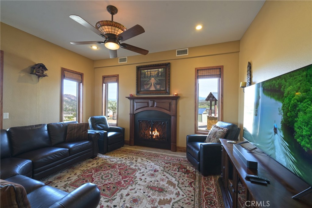 38101 Vía Lobato Temecula, CA 92592 - Photo 21 of 67 a living room with furniture and a fireplace