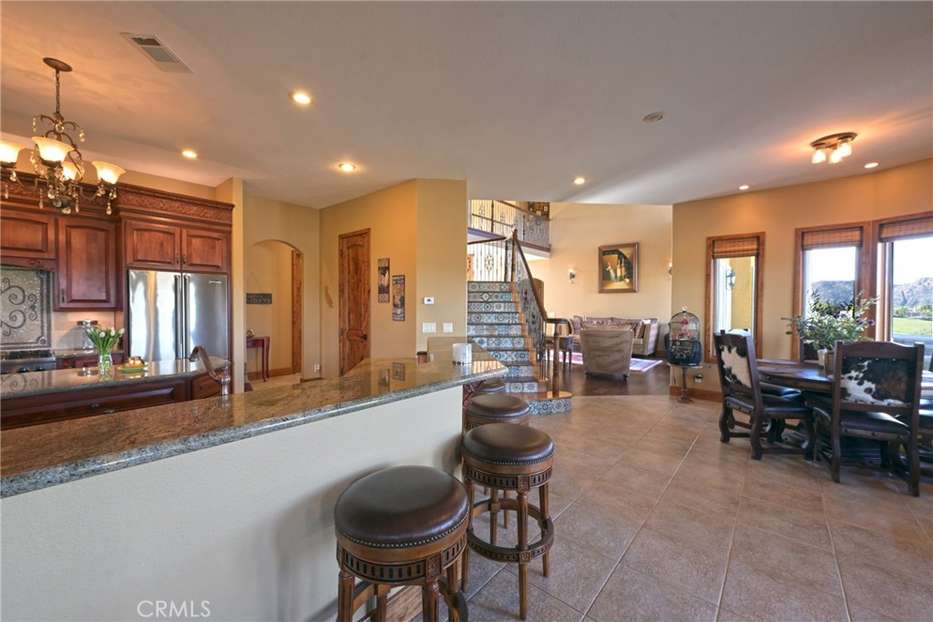 38101 Vía Lobato Temecula, CA 92592 - Photo 29 of 67 a living room with lots of furniture and a large window