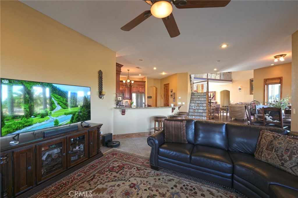 38101 Vía Lobato Temecula, CA 92592 - Photo 30 of 67 a living room with furniture and a flat screen tv