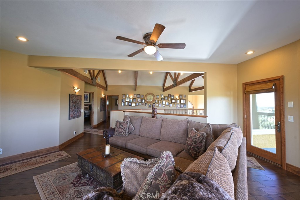 38101 Vía Lobato Temecula, CA 92592 - Photo 31 of 67 a living room with furniture and wooden floor