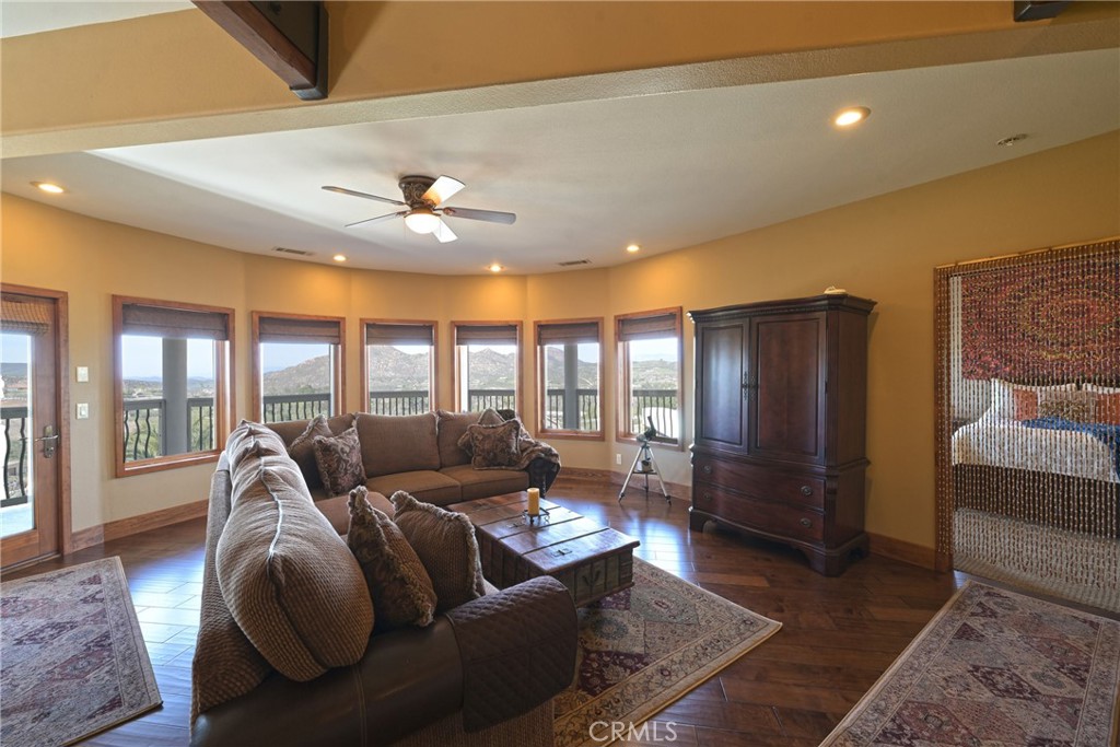 38101 Vía Lobato Temecula, CA 92592 - Photo 32 of 67 a living room with furniture and a chandelier