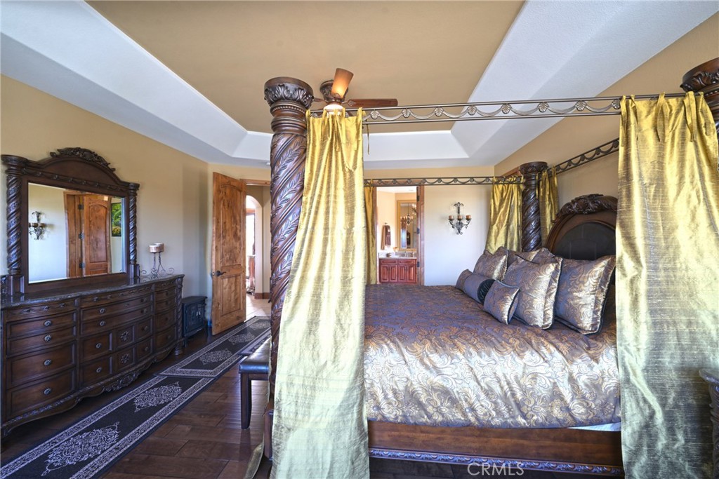 38101 Vía Lobato Temecula, CA 92592 - Photo 33 of 67 a bedroom with a bed and a mirror