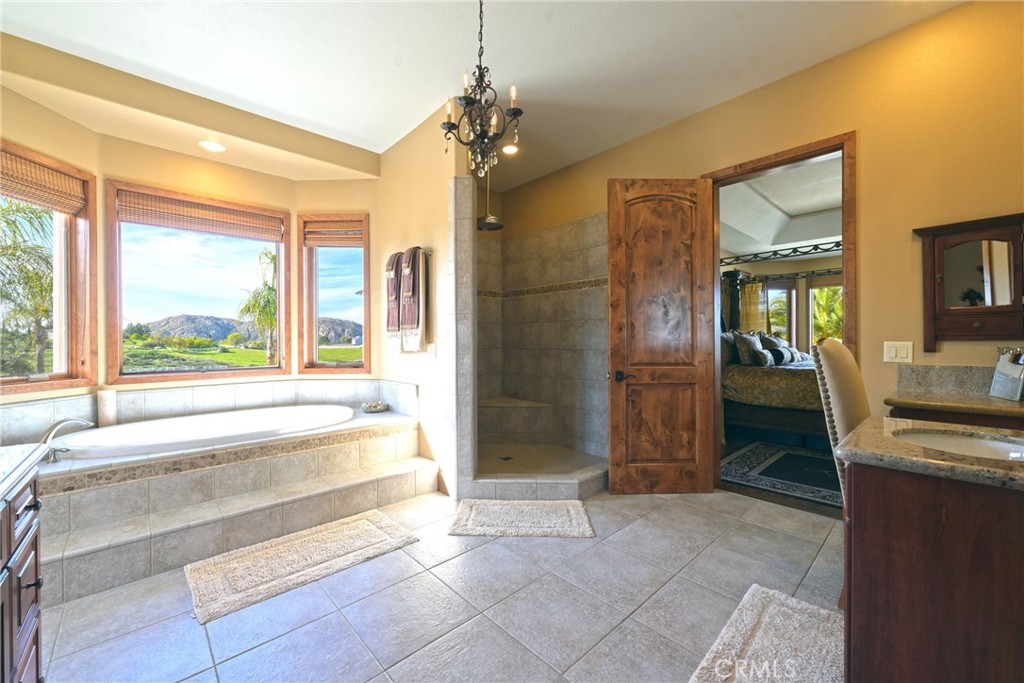 38101 Vía Lobato Temecula, CA 92592 - Photo 34 of 67 a bathroom with a tub shower and sink