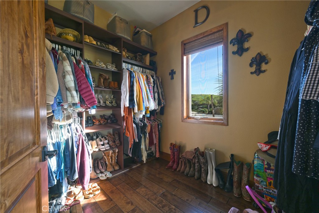 38101 Vía Lobato Temecula, CA 92592 - Photo 35 of 67 a view of walk in closet with clothes and shoes