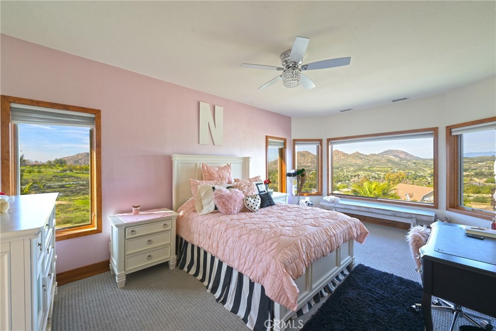 38101 Vía Lobato Temecula, CA 92592 - Photo 36 of 67 a bedroom with a bed and a large window