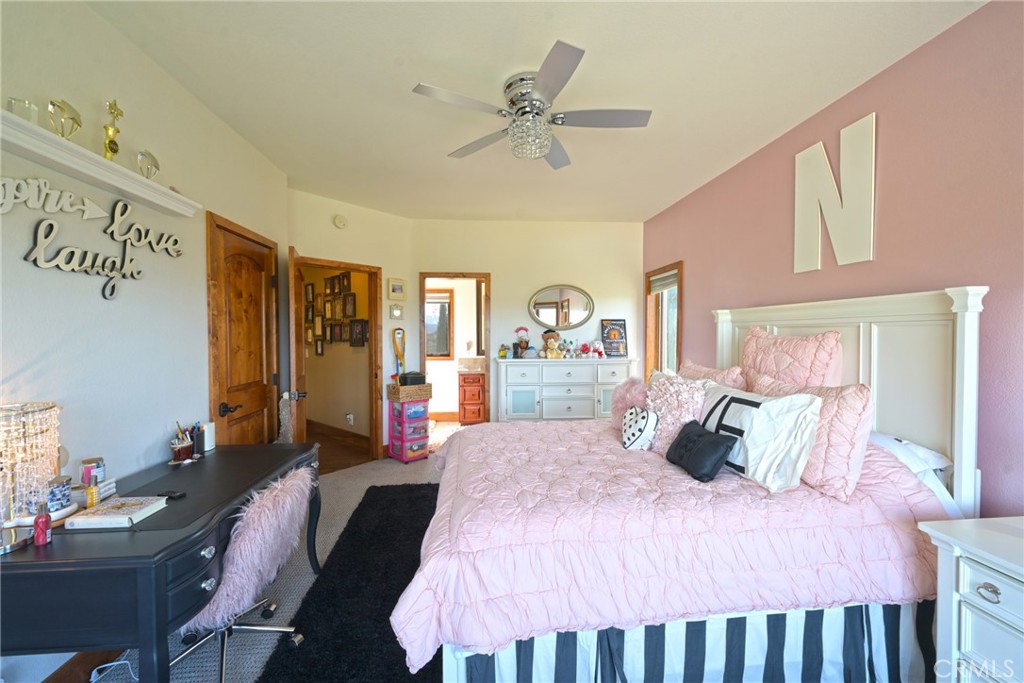 38101 Vía Lobato Temecula, CA 92592 - Photo 40 of 67 a bedroom with a bed and wooden floor