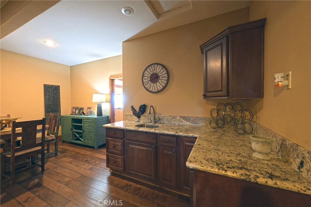 38101 Vía Lobato Temecula, CA 92592 - Photo 41 of 67 a bathroom with a granite countertop sink and a mirror