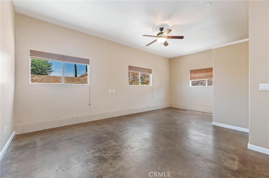 38101 Vía Lobato Temecula, CA 92592 - Photo 55 of 67 a view of a big room with wooden floor and windows in a room