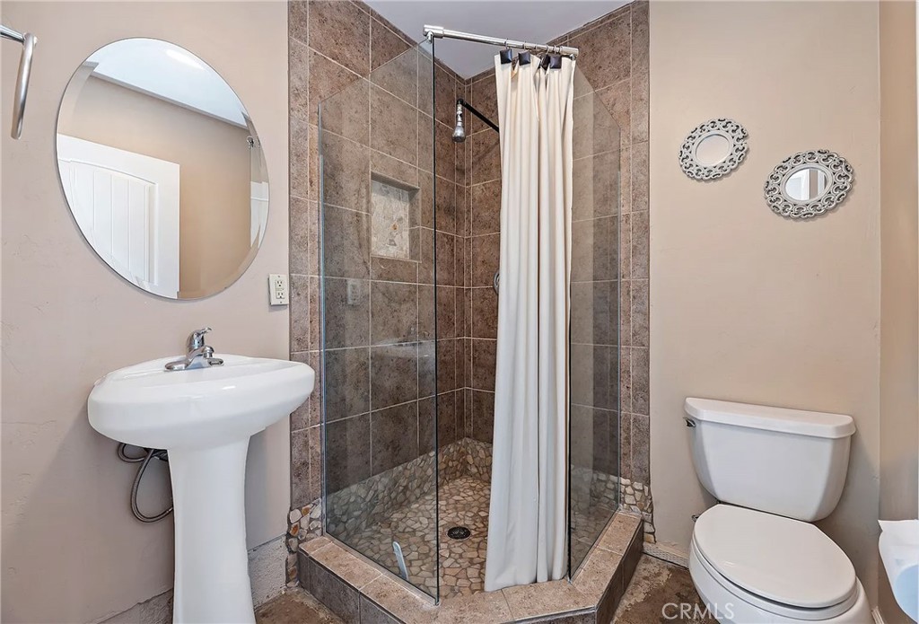 38101 Vía Lobato Temecula, CA 92592 - Photo 56 of 67 a bathroom with a sink toilet and shower