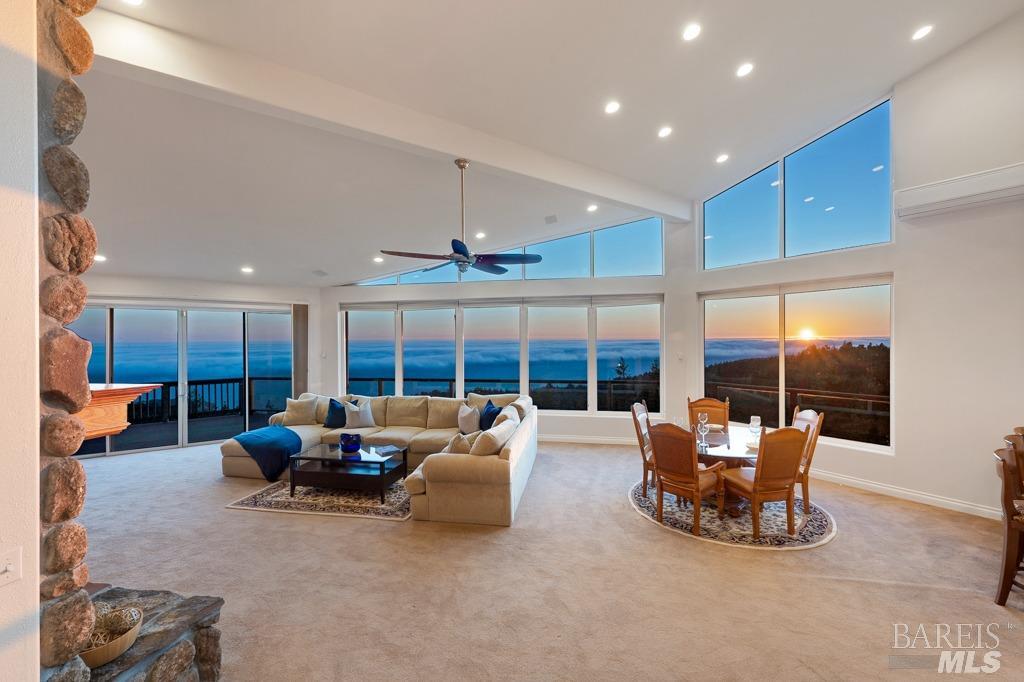 45340 Fish Rock Road Gualala, CA 95445 - Photo 1 of 1 a living room with furniture and a large window