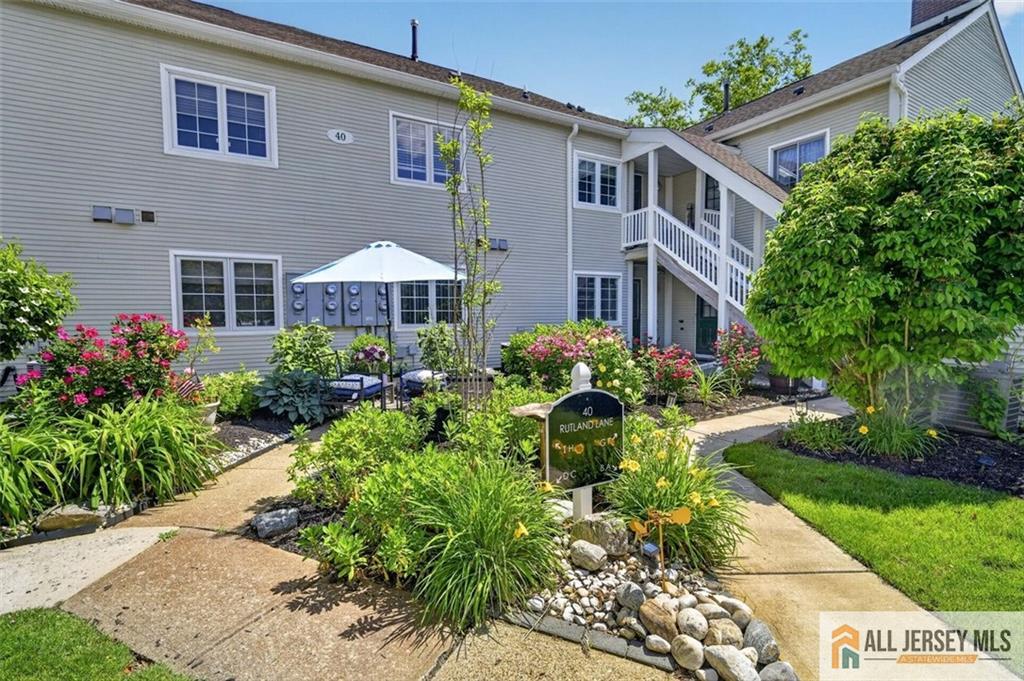 40C Rutland Lane, Unit 40B Monroe Township, NJ 08831 - Photo 33 of 37 a front view of a house with garden