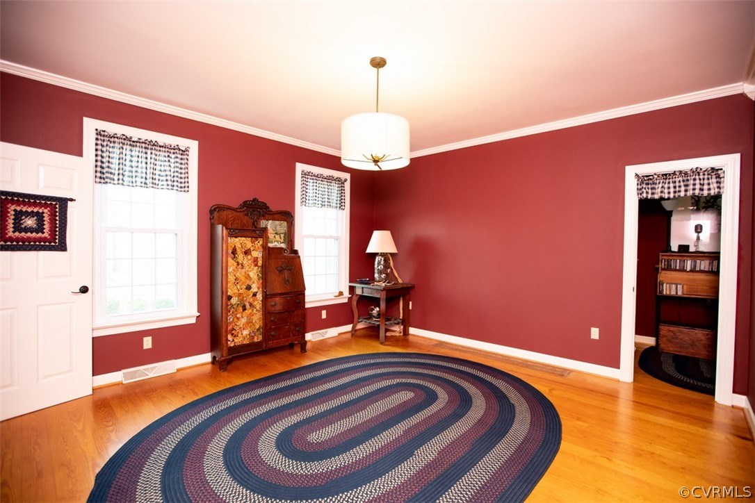 526 First Rock Road Prospect, VA 23960 - Photo 17 of 50 a bedroom with a bed and a chandelier