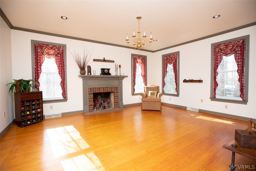 526 First Rock Road Prospect, VA 23960 - Photo 3 of 50 a view of a livingroom with a fireplace a chandelier and windows