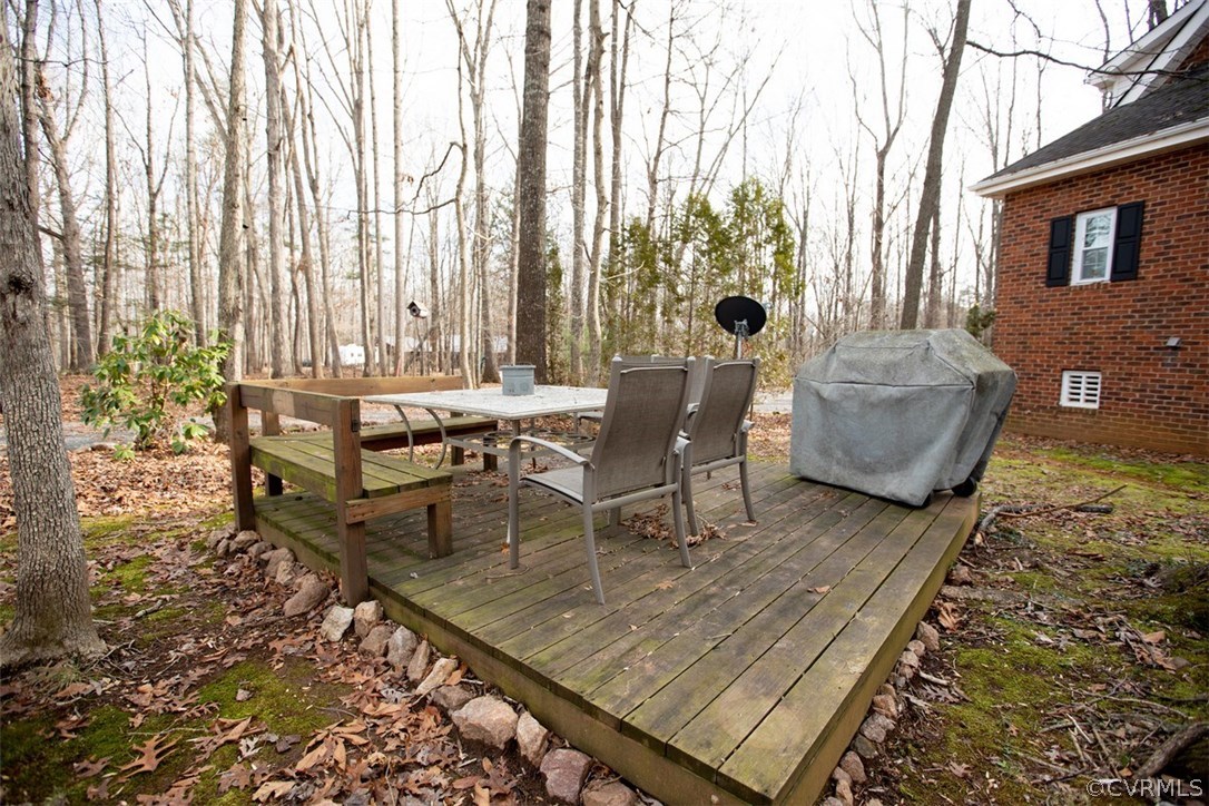 526 First Rock Road Prospect, VA 23960 - Photo 46 of 50 a view of a patio with couches and table and chairs with wooden floor