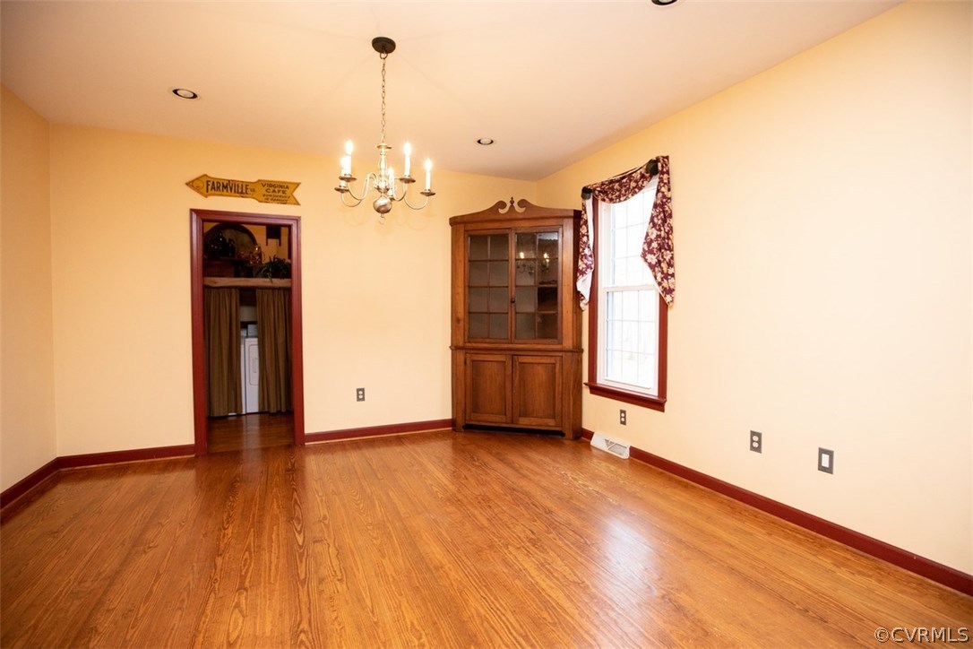 526 First Rock Road Prospect, VA 23960 - Photo 10 of 50 a view of an empty room with window and wooden floor