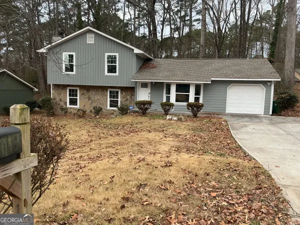 a front view of a house with yard