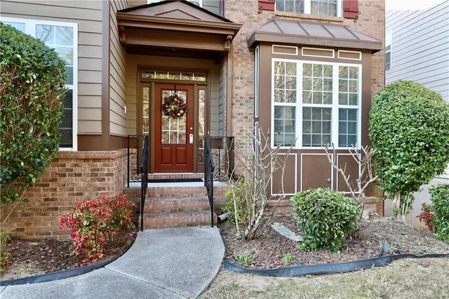 a view of an entryway with wooden floor