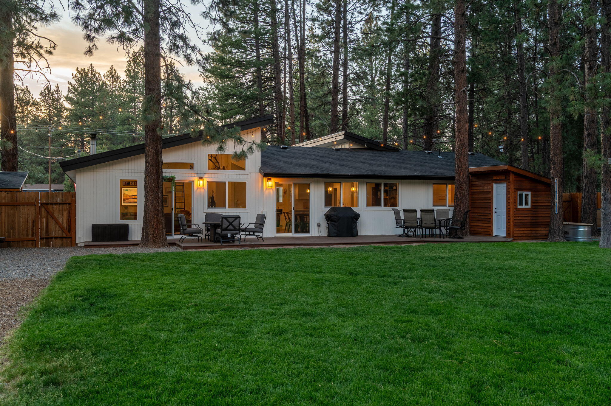 60072 Cinder Butte Road Bend, OR 97702 - Photo 4 of 60 a front view of a house with a garden