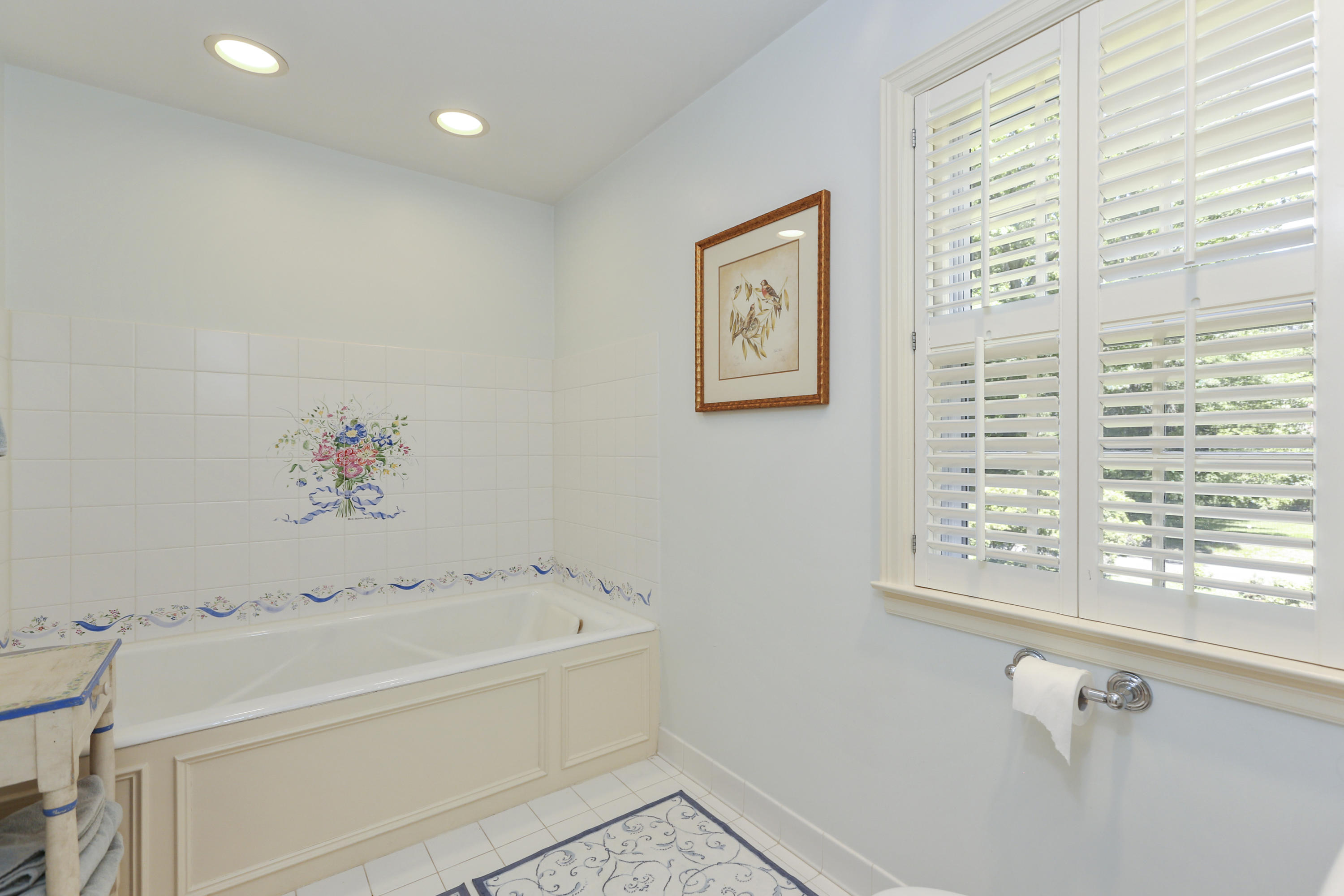 10 Deepwood Road Darien, CT 06820 - Photo 24 of 38 a bathroom with a bathtub and a shower