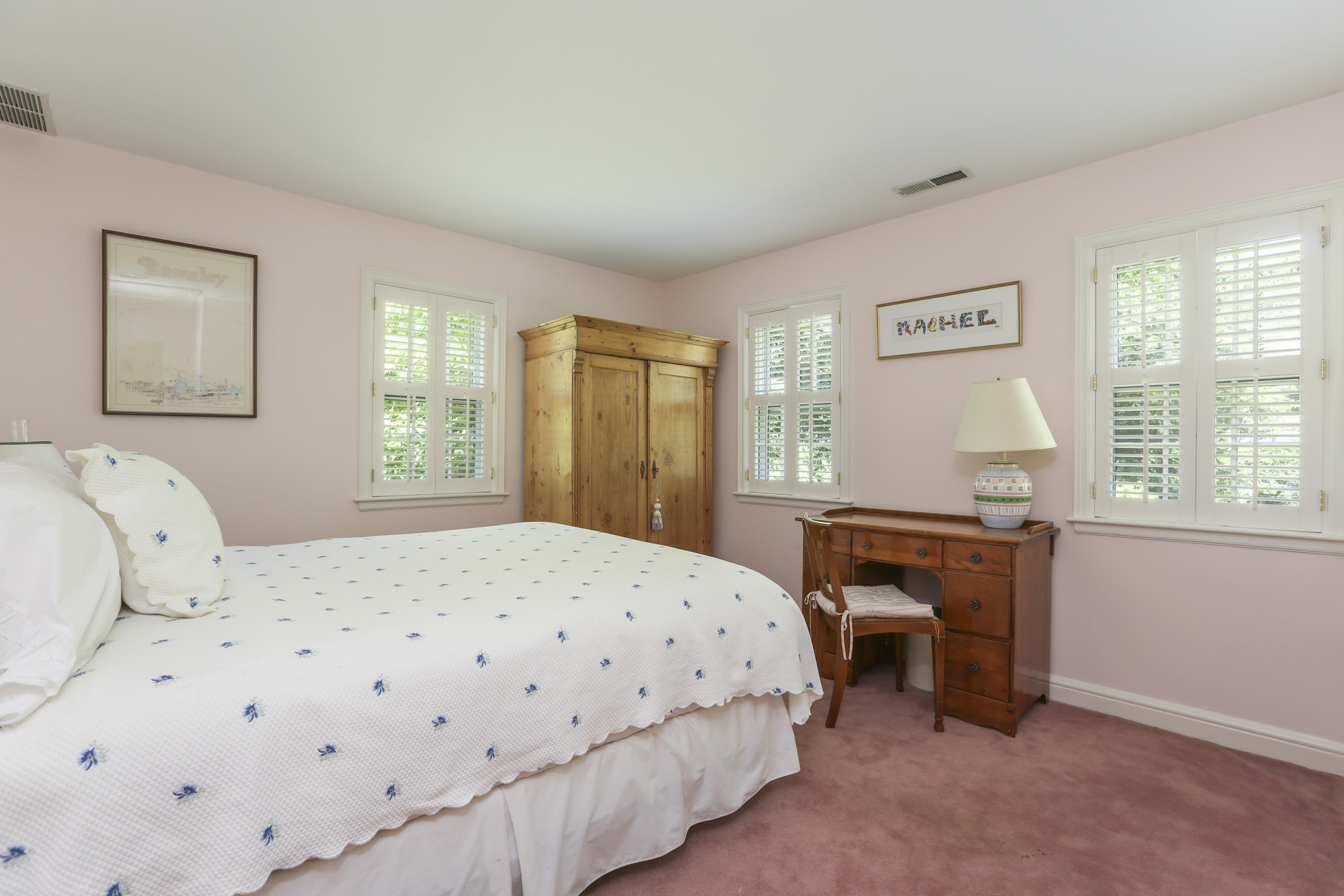 10 Deepwood Road Darien, CT 06820 - Photo 25 of 38 a bedroom with a bed and a table in it with window