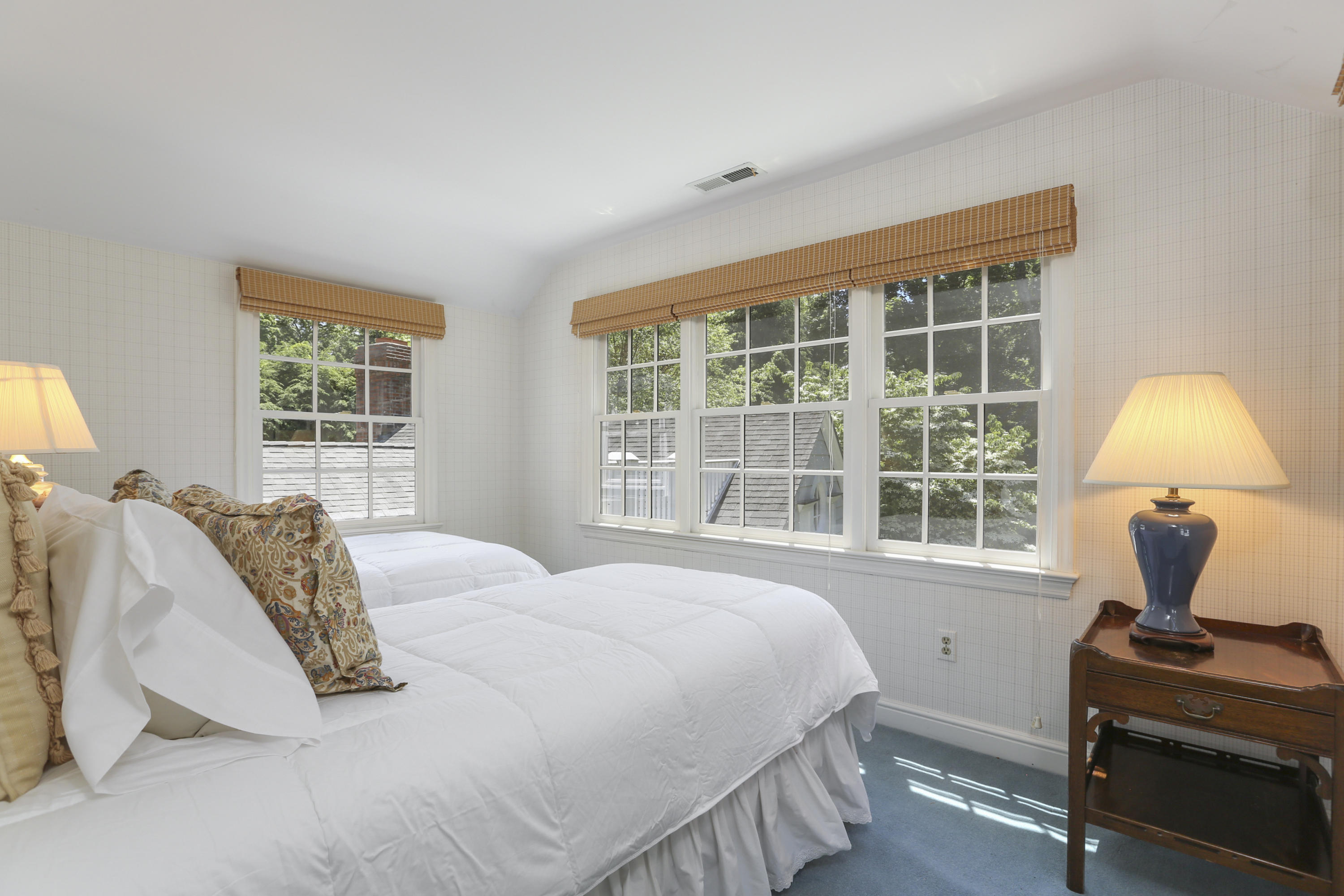 10 Deepwood Road Darien, CT 06820 - Photo 27 of 38 a bedroom with a bed and window