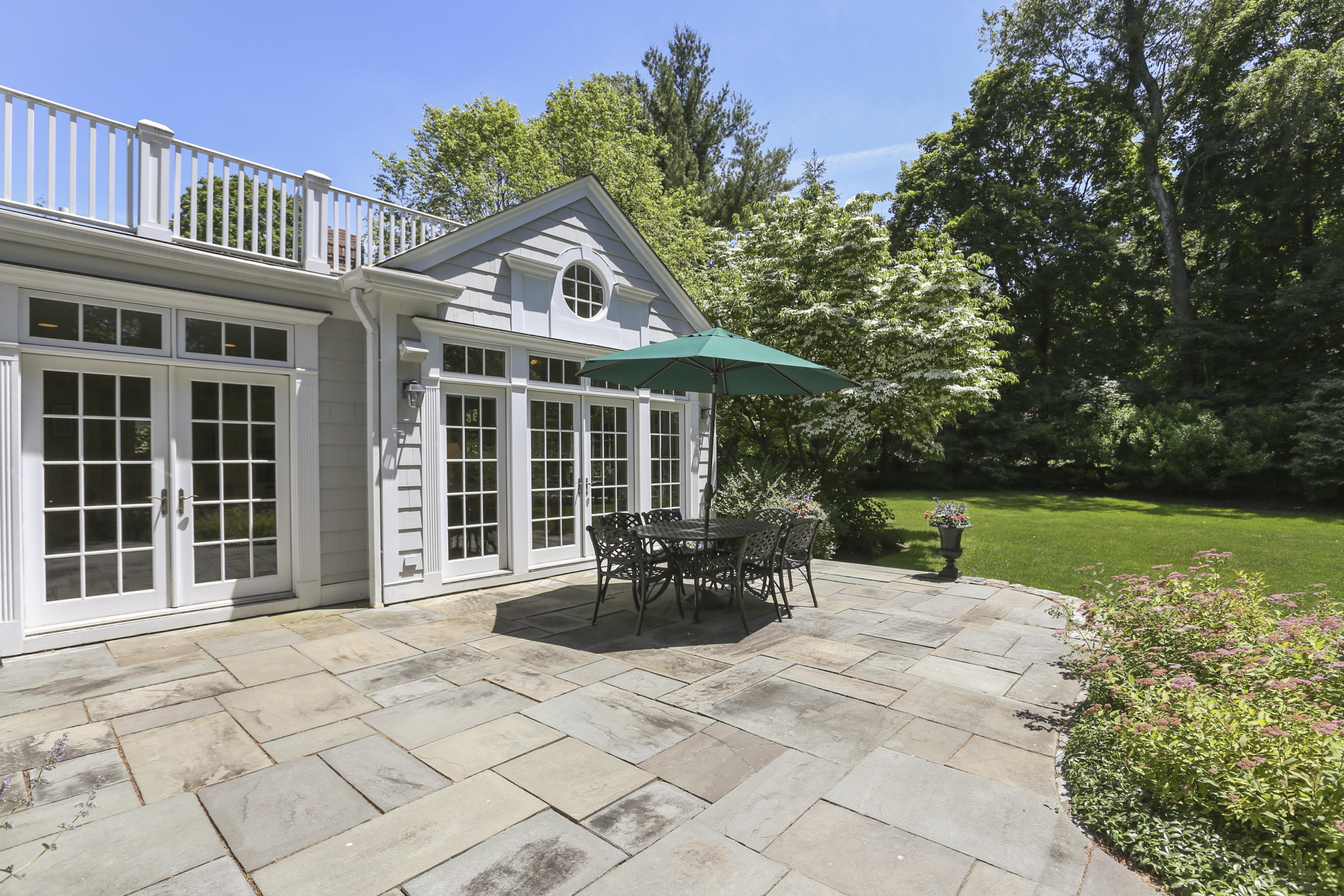 10 Deepwood Road Darien, CT 06820 - Photo 30 of 38 a front view of a house with garden and porch
