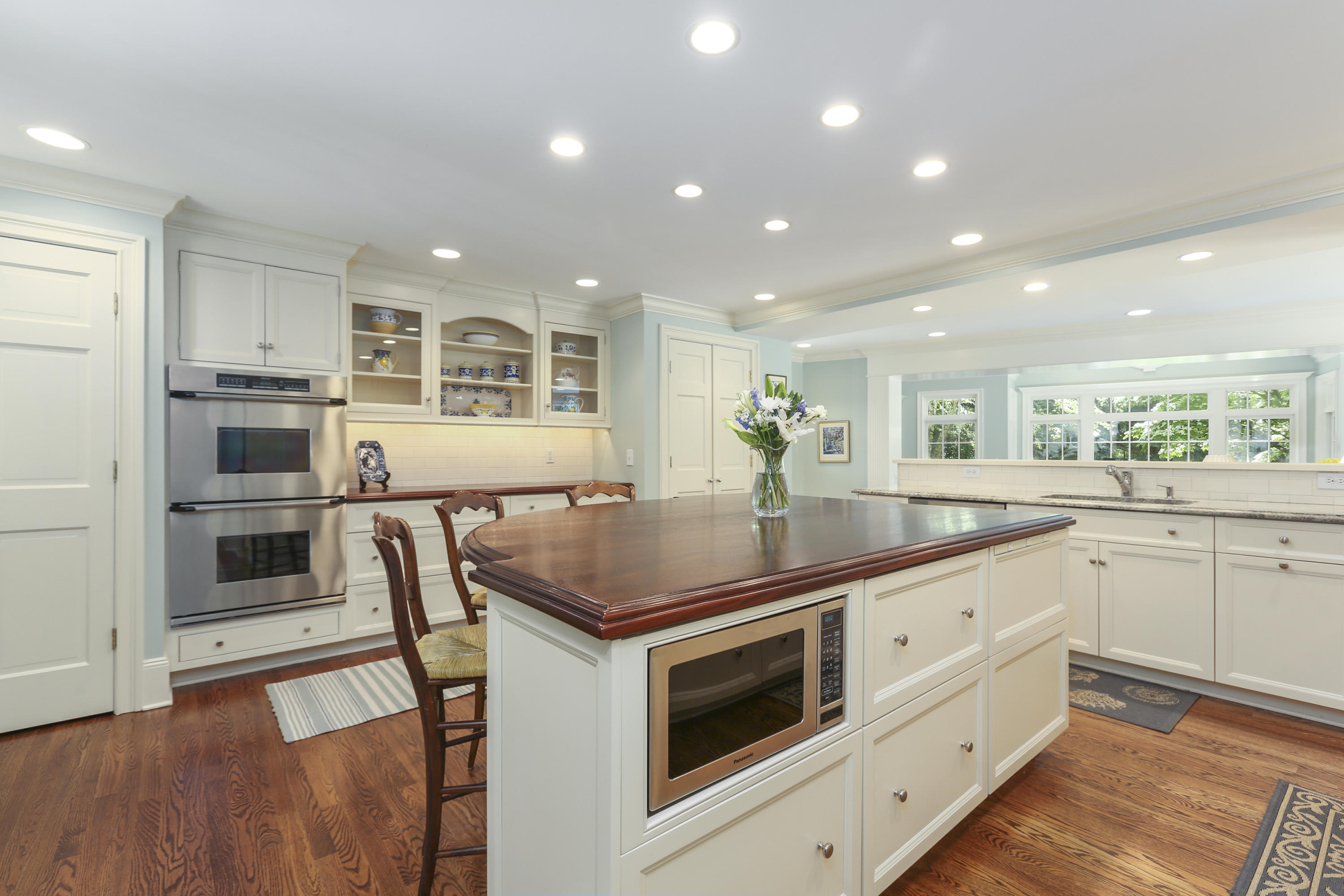 10 Deepwood Road Darien, CT 06820 - Photo 9 of 38 a kitchen with stainless steel appliances kitchen island granite countertop a stove and a sink