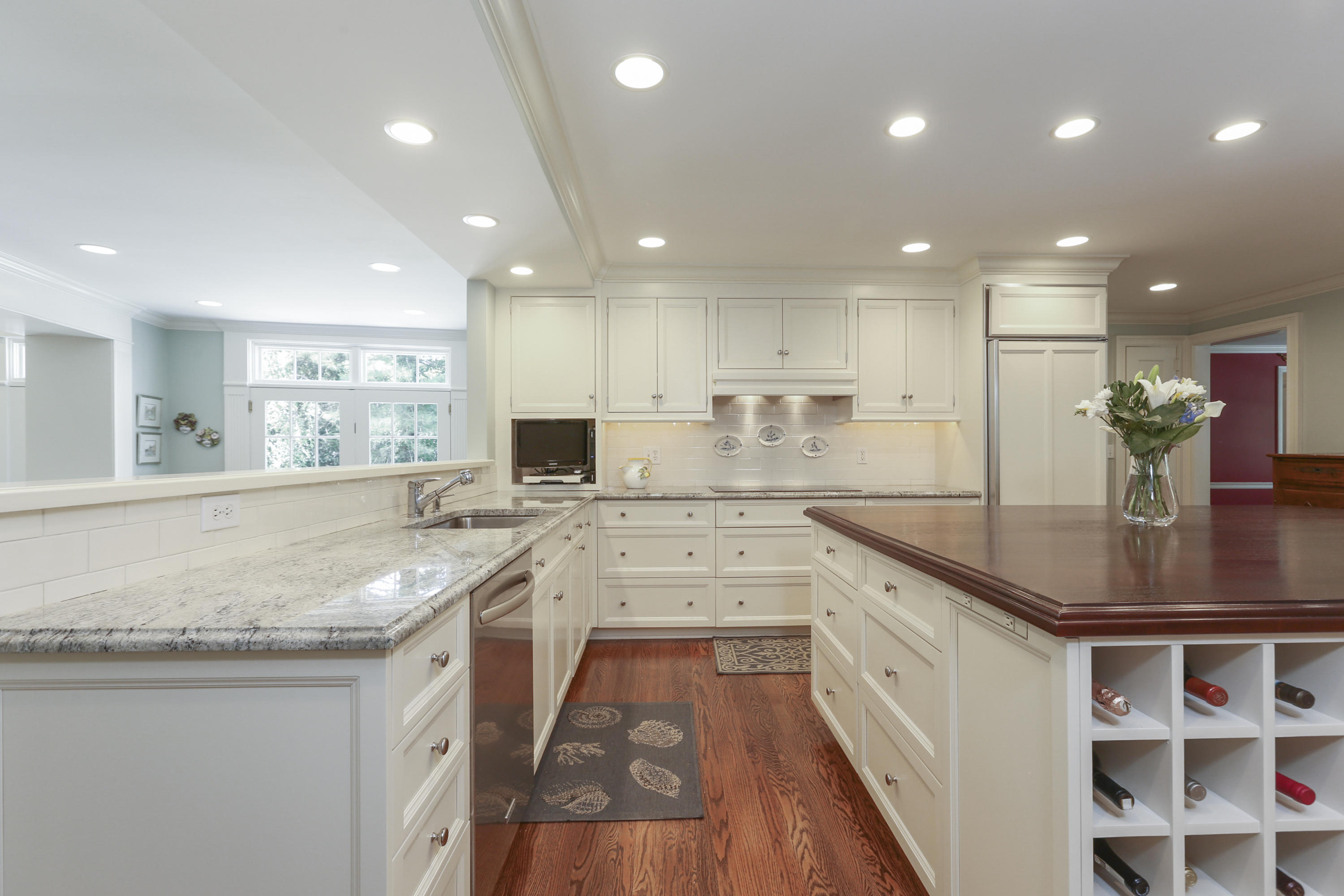 10 Deepwood Road Darien, CT 06820 - Photo 10 of 38 a kitchen with stainless steel appliances granite countertop a sink stove and cabinets