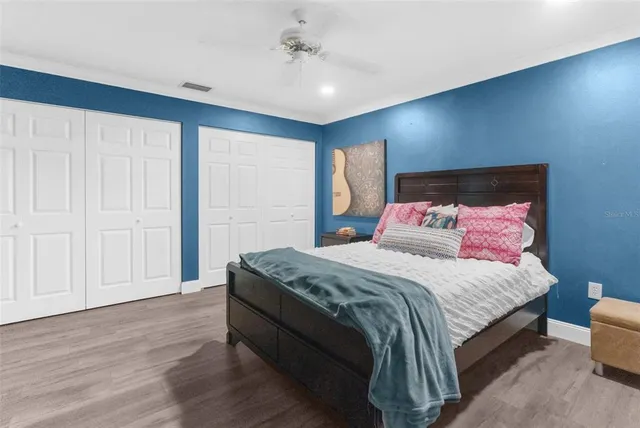 a bedroom with bed and window