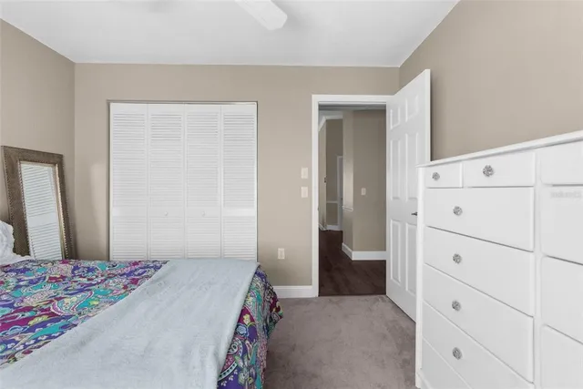 a bedroom with a bed and a dresser