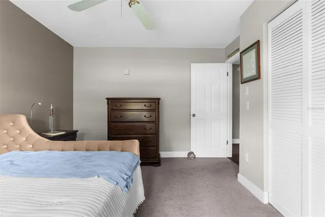 a bedroom with a bed and a closet