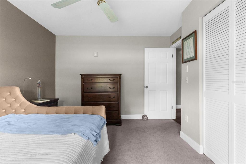 13119 Topflite Court Hudson, FL 34669 - Photo 20 of 26 a bedroom with a bed and a closet