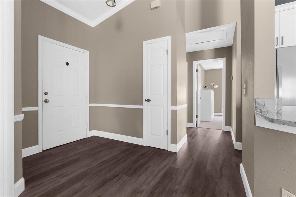 13119 Topflite Court Hudson, FL 34669 - Photo 23 of 26 a view of a hallway with wooden floor