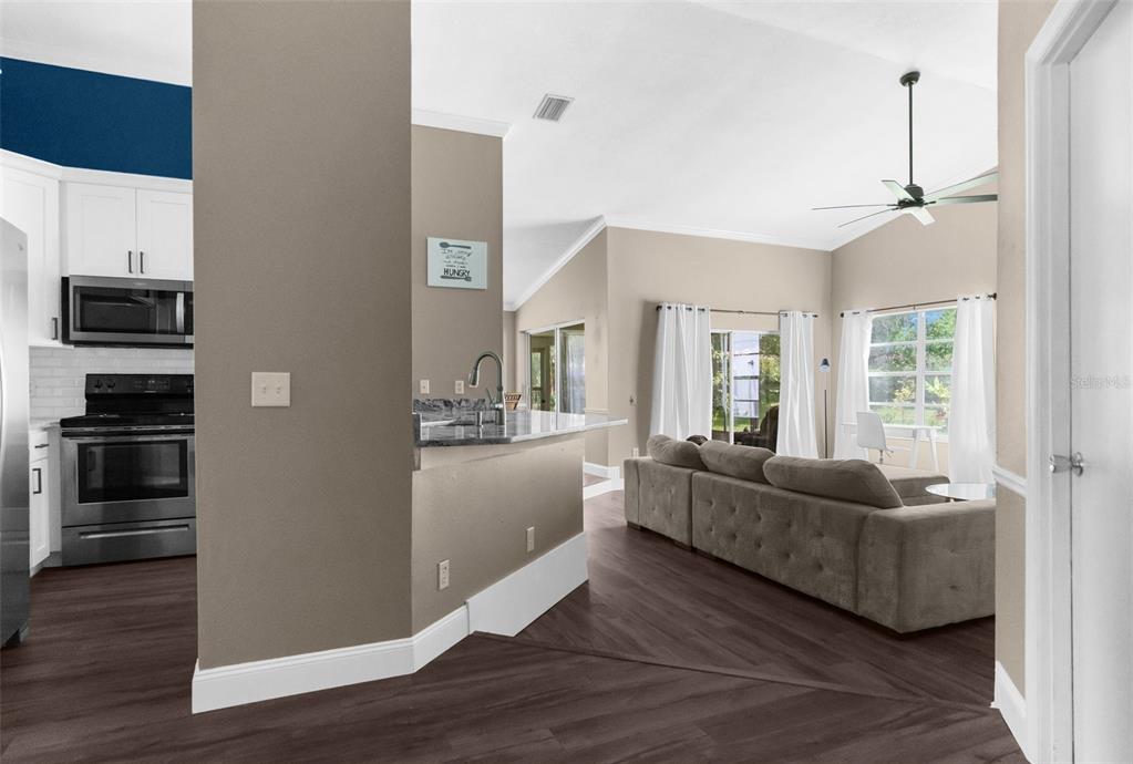 13119 Topflite Court Hudson, FL 34669 - Photo 24 of 26 a living room with furniture and a flat screen tv