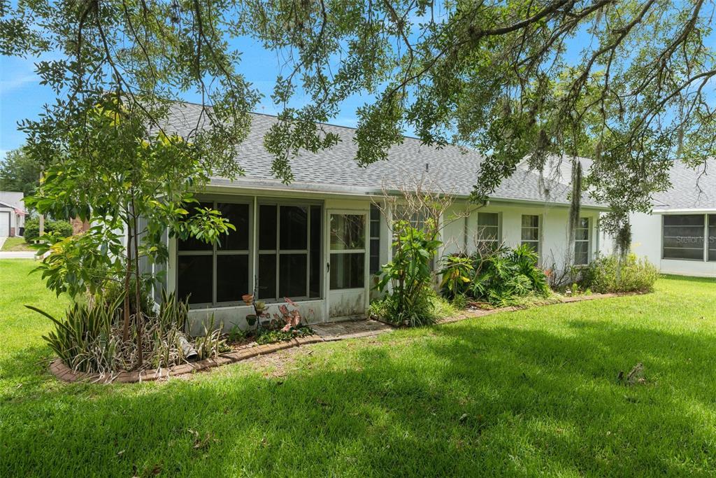 13119 Topflite Court Hudson, FL 34669 - Photo 26 of 26 a front view of a house with a yard and porch
