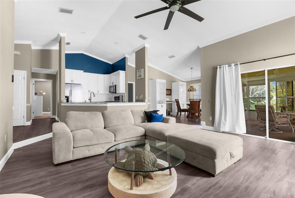 13119 Topflite Court Hudson, FL 34669 - Photo 6 of 26 a living room with furniture and a large window